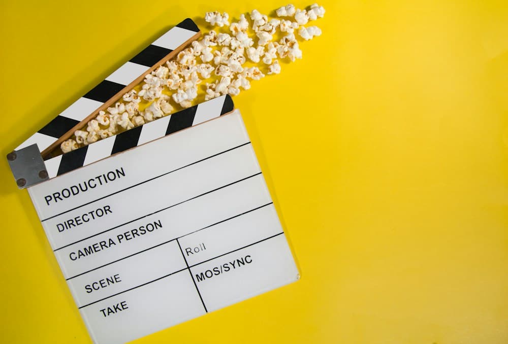 Cinematic soundstage studio set with production crew, lighting, and cameras