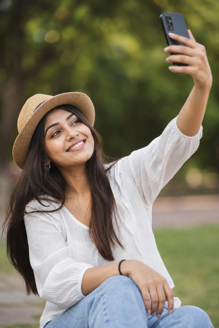Lifestyle content creator recording a selfie video outdoors