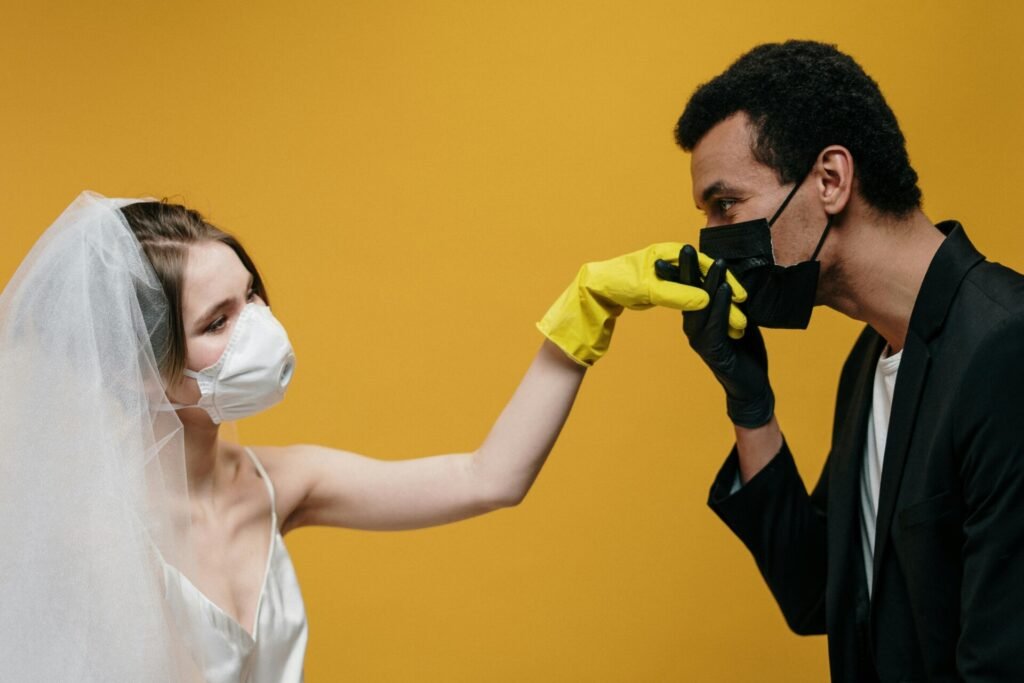 Man in Black Suit Jacket and Woman in White Dress