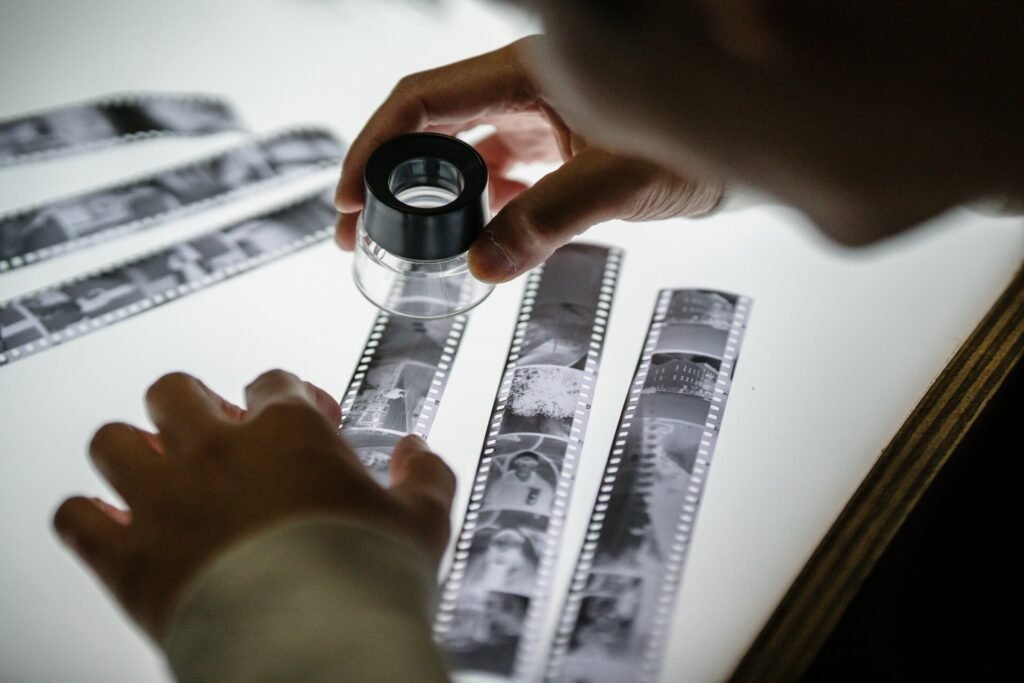 Close-up of Man Looking at an Undeveloped Film Roll