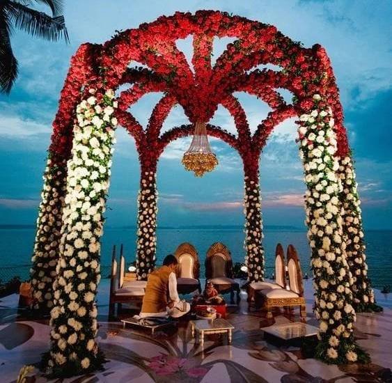 luxury floating mandap setup with roses and chandeliers in Rajasthan